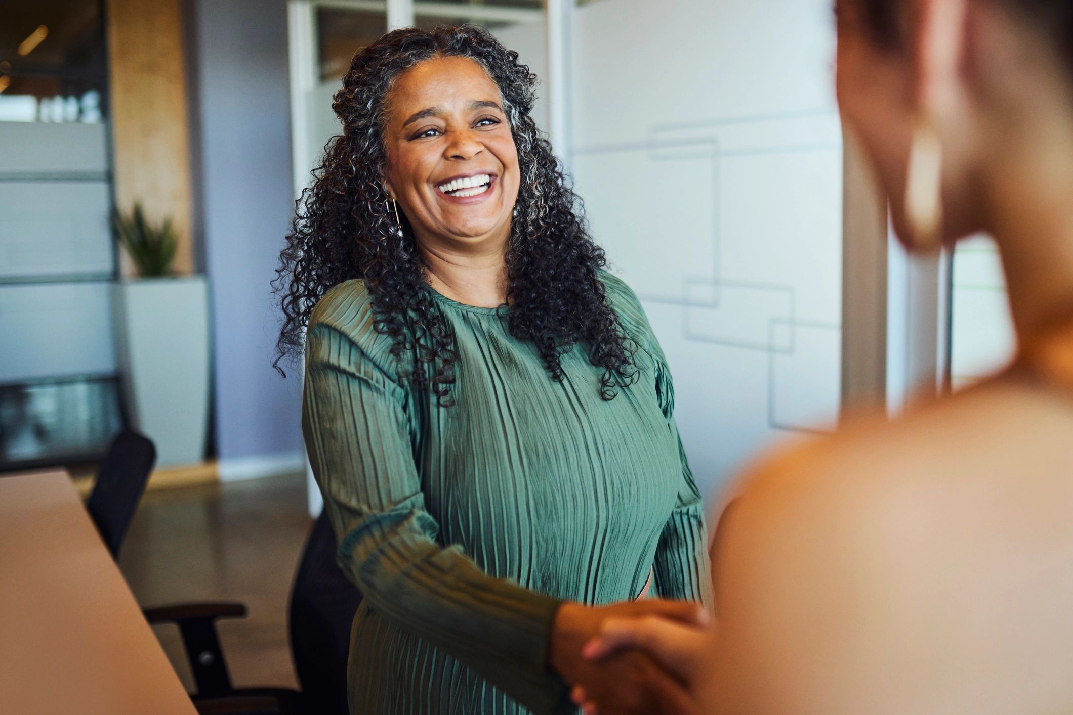 Professional handshake symbolising trust and partnership